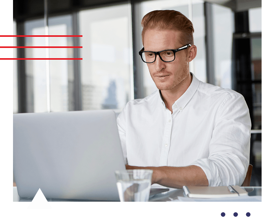 A man types away on his laptop