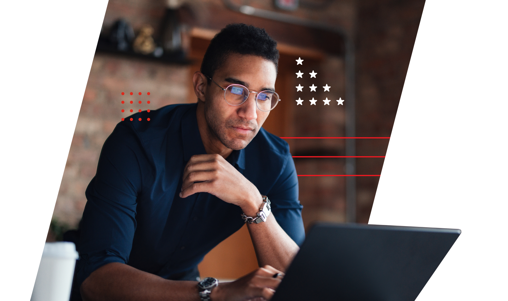 A man thoughtfully looks at his laptop screen